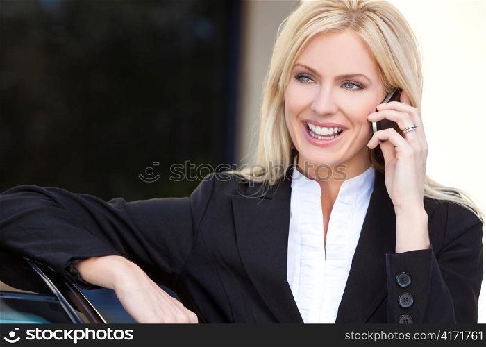 Blond Businesswoman Talking On Her Cell Phone
