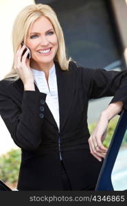 Blond Businesswoman Talking On Her Cell Phone