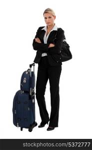 Blond businesswoman with luggage