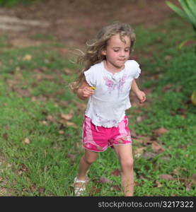 Blond Child in Shorts Running at Moorea in Tahiti