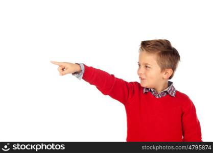 Blond child with red jersey pointing with his finger isolated on white background