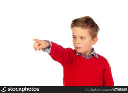 Blond child with red jersey pointing with his finger isolated on white background