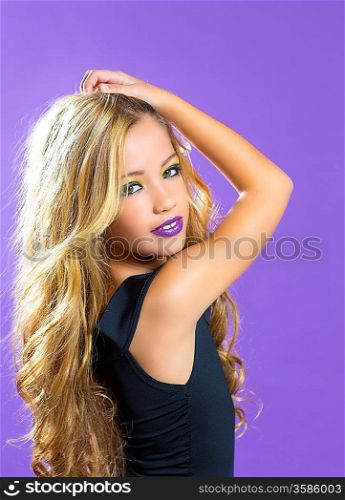 Blond children fashiondoll girl fashion makeup on purple background