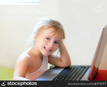 blond children girl smiling with computer laptop