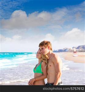 Blond couple of young tourists in a tropical summer beach palms trees in Mexico photo mount
