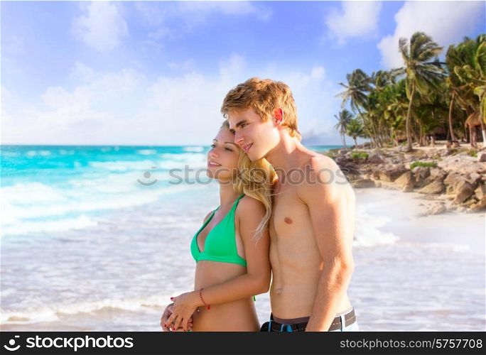 Blond couple of young tourists in a tropical summer beach palms trees in Mexico photo mount
