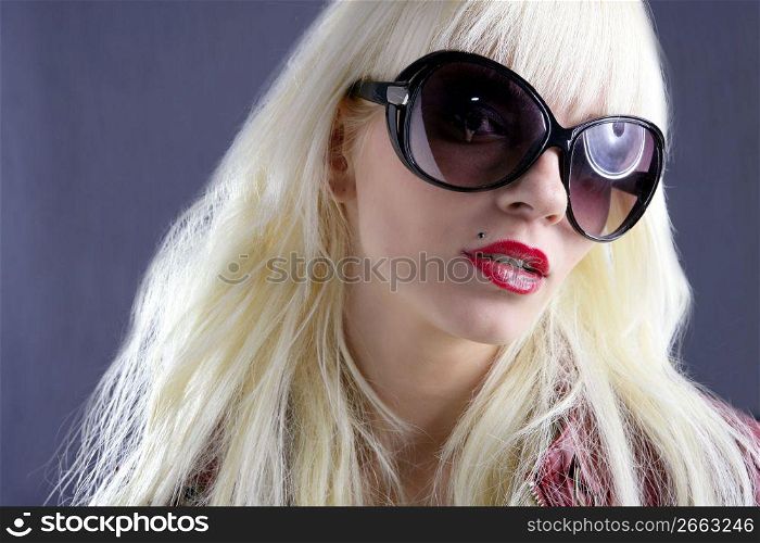 blond fashion girl portrait red lips gray background