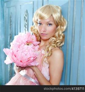blond fashion princess and vintage spring flowers dress on blue wardrobe