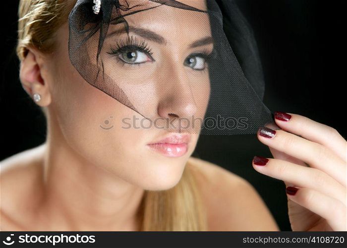 Blond fashion woman portrait with tulle over black