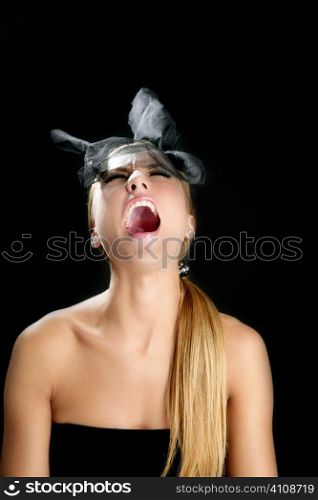 Blond fashion woman with scream shout expression over black