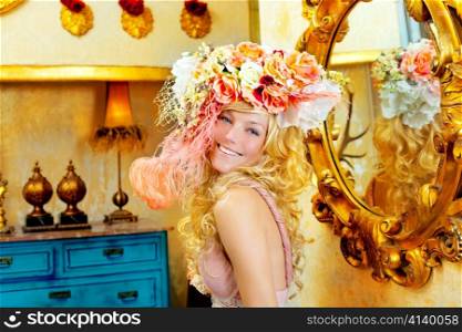blond fashion woman with spring flowers hat in baroque grunge house
