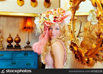 blond fashion woman with spring flowers hat in baroque grunge house