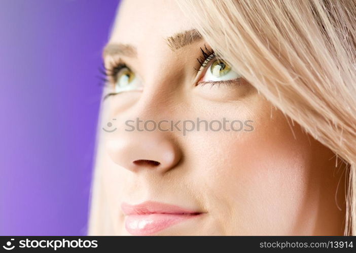 Blond girl against colourful background