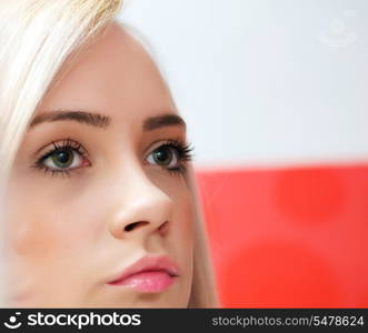 Blond girl against colourful background