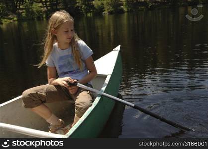Blond girl canoeing