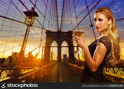 Blond girl cheers with vermouth cup in New york sunset photomount