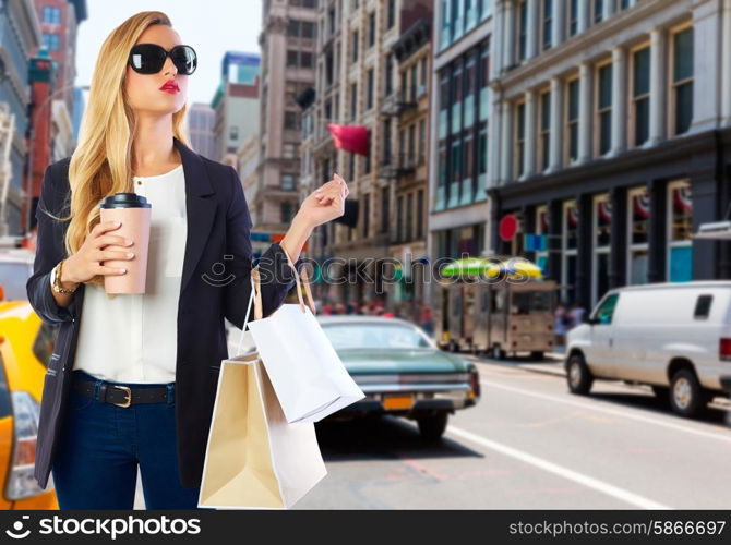 Blond girl shopaholic in Manhattan Soho New York shopping with coffee Photomount