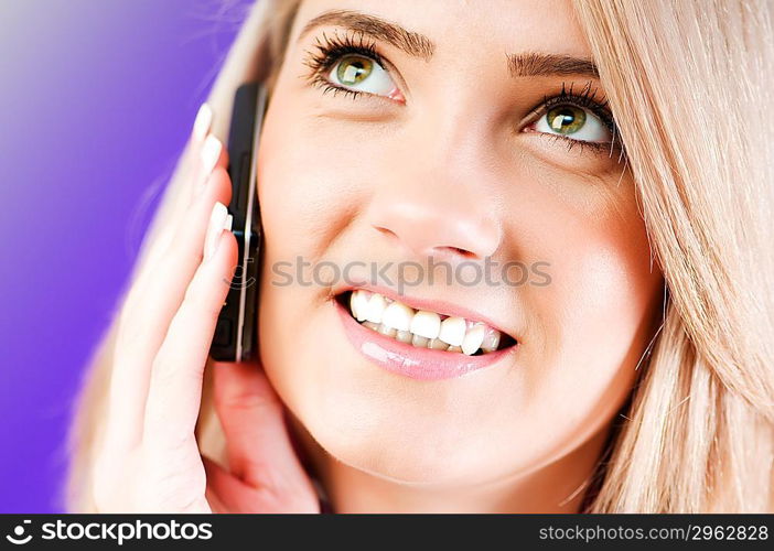 Blond girl talking on mobile phone