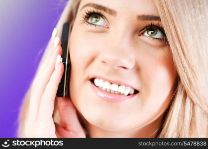 Blond girl talking on mobile phone