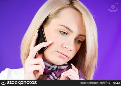 Blond girl talking on mobile phone
