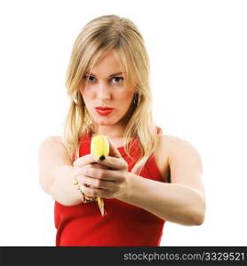 Blond girl using a banana like a gun threatening the viewer