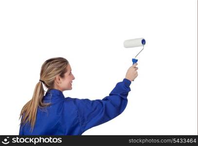 Blond girl with a roller painting a white wall