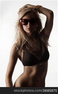 blond girl with sunglasses posing
