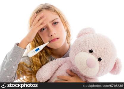 blond girl with thermometer and flu cold in pyjama grumpy face with teddy bear