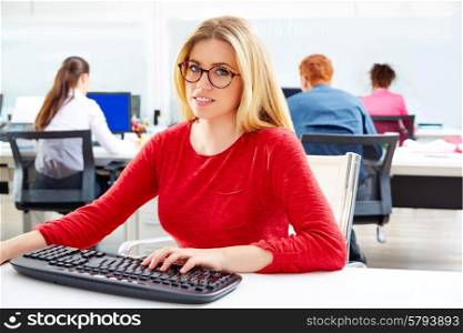 Blond glasses businesswoman working office with computer at desk