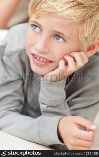 Blond Hair Blue Eyes Boy Child Resting on His Hands