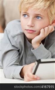 Blond Hair Blue Eyes Boy Child Using Tablet Computer