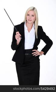 Blond instructor holding stick