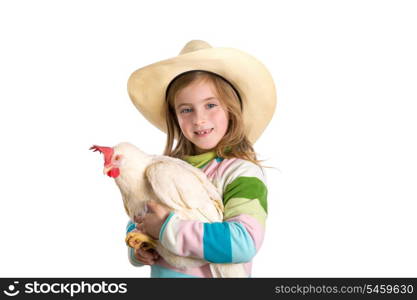 Blond kid girl farmer holding white hen on arms with cowboy hat