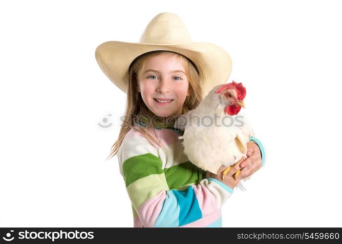 Blond kid girl farmer holding white hen on arms with cowboy hat