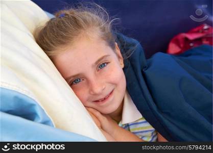 Blond kid girl tired relaxed with indented smile