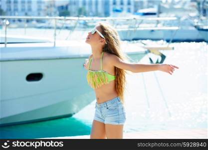 Blond kid teen girl in Mediterranean port of Spain