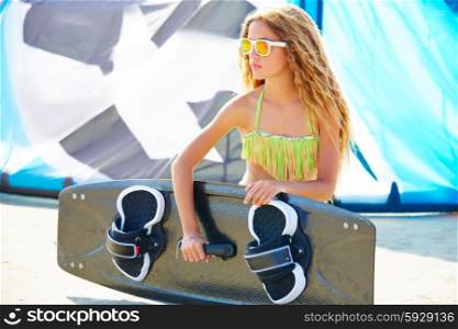 Blond kite surf teen girl in summer beach at Mediterranean