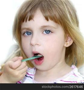 blond little girl eating ice cream color spoon portrait