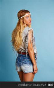 Blond long hair girl with jeans shorts and summer shirt on blue