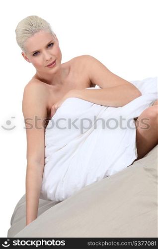 Blond model sat in bed