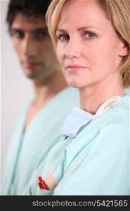 Blond nurse stood with male colleague