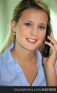 Blond office worker making phone call