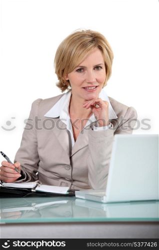 Blond office worker sat at desk
