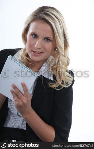 Blond receptionist taking notes
