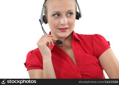 Blond receptionist using telephone head-set