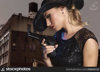 Blond sexy girl with handgun pistol gangster style in New York Photomount