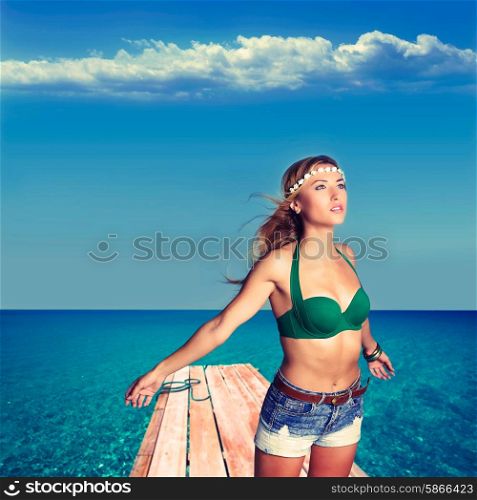 Blond sexy tourist girl in tropical beach pier of Formentera photomount
