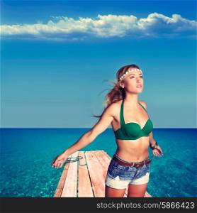 Blond sexy tourist girl in tropical beach pier of Formentera photomount