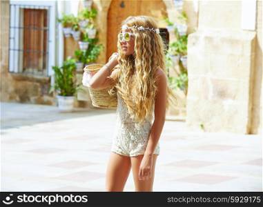 Blond teen girl tourist in Mediterranean old town profile with curly hair