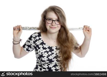 blond teenage girl wearing glasses holds flute in studio against white background